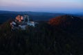 Late evening, artisitic, aerial view of monumental Buchlov Castle, lit by setting sun. Czech republic. Royalty Free Stock Photo