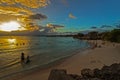 Late evening at Oistins beach on Barbados South Coast with the calm blue waters of the Caribbean Sea.