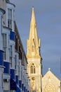 Late evening sun setting on the spire and steeple of church in W Royalty Free Stock Photo