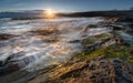 Late light catching surf over rocks, Constantine Bay, Cornwall Royalty Free Stock Photo