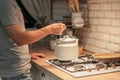 Late night tea habit man putting kettle stove Royalty Free Stock Photo