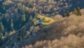 First snow on rocky hills of Montseny mountain forests