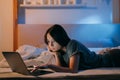 late online night insomnia bored woman laptop bed Royalty Free Stock Photo