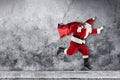 Late Santa claus in a hurry with traditional red white costume a Royalty Free Stock Photo