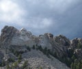 Late Spring in the South Dakota Black Hills: Sunshine and Shadows on Mount Rushmore National Memorial as Storm Clouds Approach Royalty Free Stock Photo