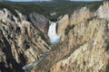 Spring in Yellowstone: Faint Rainbow at Lower Falls Base in the Grand Canyon of the Yellowstone River Seen From Artist Point Royalty Free Stock Photo