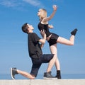 Late teenagers dancing outdoors Royalty Free Stock Photo