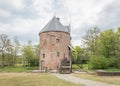 Late 13th century Dutch castle, with trees and cloudy sky