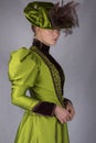 Late Victorian woman in green silk ensemble Royalty Free Stock Photo