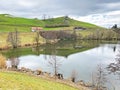 Late winter and early spring on the small natural lake Wilersee or Wiler lake above the canyon of the river Sihl, Menzingen Royalty Free Stock Photo