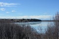 Late-winter landscape of melting ice on lake with reflection Royalty Free Stock Photo