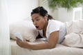 Late For Work. Shocked Overslept Black Woman Looking At Smartphone In Hand