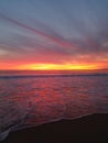 Late yellow pink red purple sunset over the beach 4k