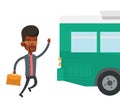 Latecomer man running for the bus. Royalty Free Stock Photo