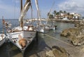 Lateen sail antique mediterranean watercraft on traditional fishing village in mallorca