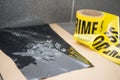 Latent footprint evidence with crime scene tape in crime scene i Royalty Free Stock Photo