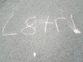 later written in shorthand in chalk on asphalt