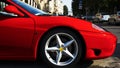 Lateral front side of shiny metallic red fast car Royalty Free Stock Photo