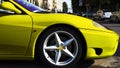 Lateral front side of shiny metallic yellow sport car Royalty Free Stock Photo