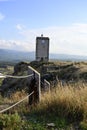 Lateral view of an old clock tower on top of a hill in Monroyo, Spain Royalty Free Stock Photo