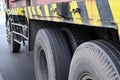 Lateral view of the tires of a container truck or truck on the road