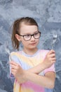 Laterality. The girl holds a fork in both left and right hands. He can use both hands. Royalty Free Stock Photo