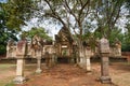 Laterite stone paved walkway with free-standing stone posts to the gates of ancient Khmer temple built of red sandstone and lateri