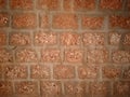 Laterite stone wall texture background. Royalty Free Stock Photo