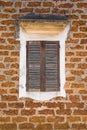 Laterite wall background with vintage wooden windows. Retro style Royalty Free Stock Photo