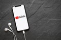 Riga, Latvia - March 25, 2018: Latest generation iPhone X with YouTube logo on the screen. Royalty Free Stock Photo