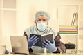 Latest scientific findings and knowledge on coronavirus disease. Learn how protect yourself. Man reading book. Medical Royalty Free Stock Photo