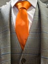 Latest trends in Suit, shirt and tie combination - Orange tie Royalty Free Stock Photo