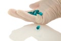 Latex Gloved Hand Holding Pills Royalty Free Stock Photo