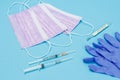 Latex gloves, masks, syringes and a glass mercury thermometer