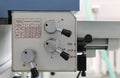 Lathe machine control panel. A close-up of a lathe machine control panel with feed adjustment levers.