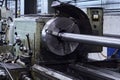 Lathe with a workpiece fixed in the spindle faceplate in the workshop Royalty Free Stock Photo