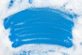Lather. Background of dusty foam with bubbles of blue color for an inscription. Soap sud with copy-space Royalty Free Stock Photo