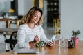 Latin adult woman eating salad bowl lunch at the office in Mexico Latin America Royalty Free Stock Photo