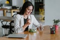 Latin adult woman eating salad lunch at the office in Mexico Latin America Royalty Free Stock Photo