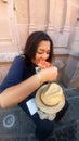 Latin adult woman eats tostadas de cueritos in the colonial streets of latin america, delicious traditional street food and part o