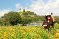 Latin adult woman in field of yellow flowers, day of the dead flower in Cholula Puebla Mexico Royalty Free Stock Photo