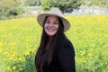 Latin adult woman in field of yellow flowers, day of the dead flower in Cholula Puebla Mexico Royalty Free Stock Photo