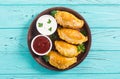 Latin American baked beef empanadas with sauce Royalty Free Stock Photo