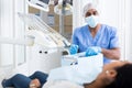 Dentist preparing special medical tools in dental office