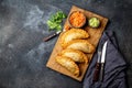 Latin American fried empanadas with tomato and avocado sauces. Top view