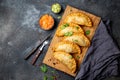 Latin American fried empanadas with tomato and avocado sauces. Top view Royalty Free Stock Photo