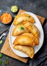 Latin American fried empanadas with tomato and avocado sauces. Top view Royalty Free Stock Photo