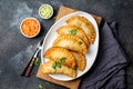 Latin American fried empanadas with tomato and avocado sauces. Top view Royalty Free Stock Photo