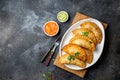 Latin American fried empanadas with tomato and avocado sauces. Top view Royalty Free Stock Photo