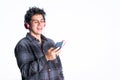 Latin American teenager listening to music on his cell phone. Royalty Free Stock Photo